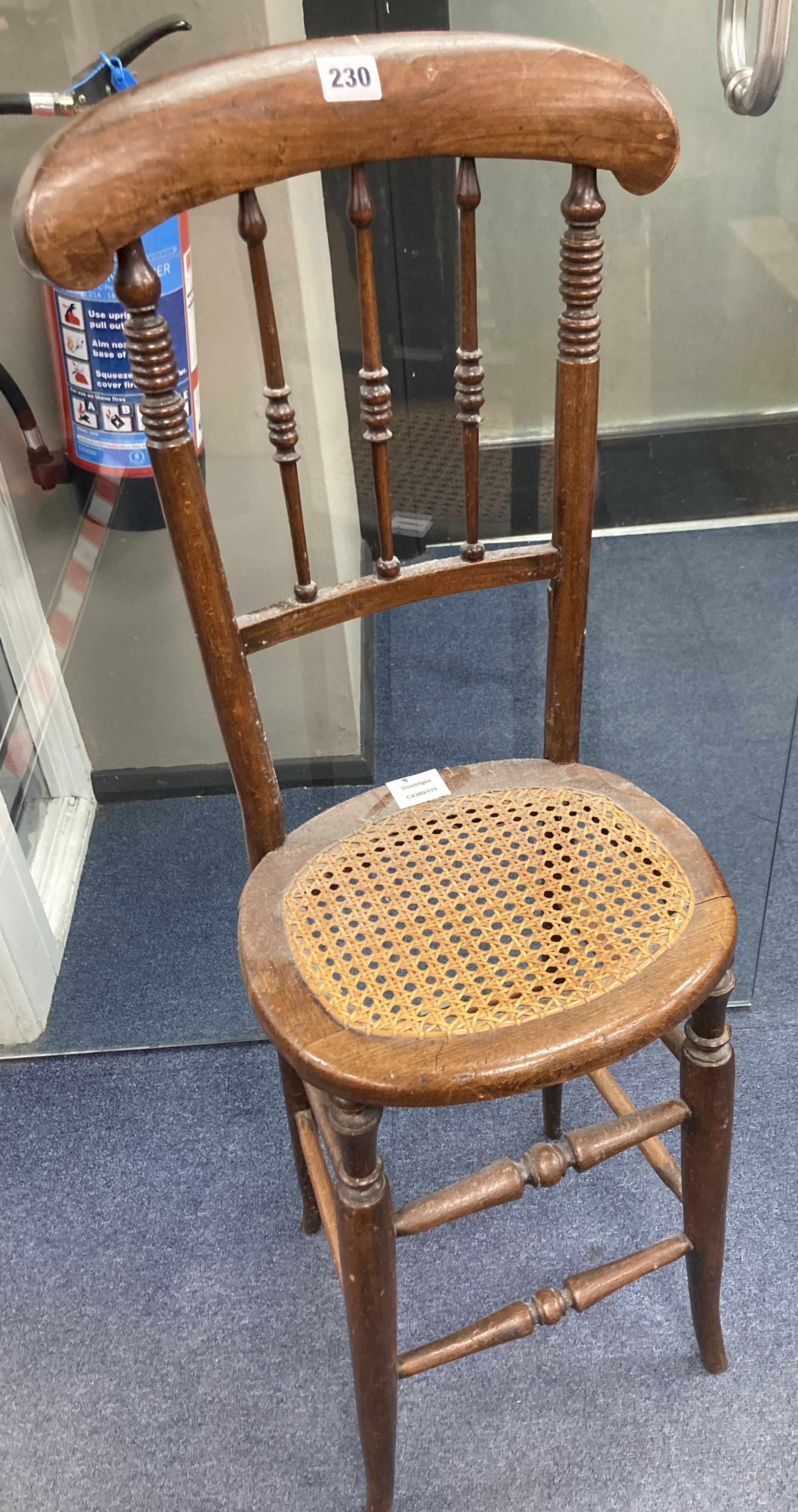 A Victorian beech cane seat correction chair